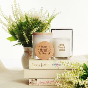 Vase, personalised soy candle and decorative books vignette.