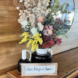 Floral arrangement & framed quote vignette.
