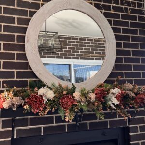 Rustic floral garland on mantle