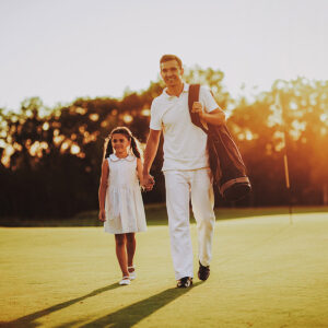 dad and daughter golfing